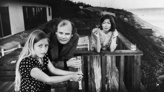 PHOTO: On a patio deck overlooking the ocean, Quintana Roo Dunne, left, leans on a railing with her parents, American authors and scriptwriters John Gregory Dunne and Joan Didion, in Malibu, Calif., in 1976.