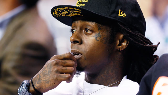 PHOTO: Rapper Lil Wayne watches the game between the Duke Blue Devils and the Kentucky Wildcats during the 2012 State Farm Champions Classic at Georgia Dome, Nov. 13, 2012 in Atlanta, Ga.