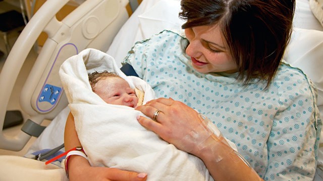 PHOTO: Mother holding newborn