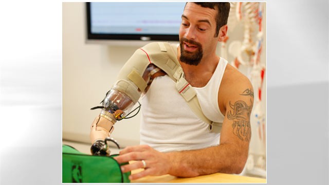 PHOTO: Glen Lehman testing a "bionic arm" at the Rehabilitation Institute of Chicagos Center for Bionic Medicine.