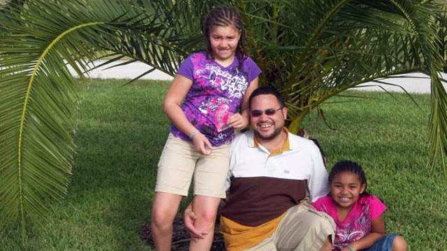 PHOTO: Reynard Zweifel of Kansas City, Mo., with his daughters Amaya, 11, and Leigha, 8.