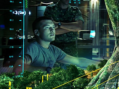 Jake (Sam Worthington) gets a virtual look at a massive, gnarled and ancient willow tree that is the Na'vi epicenter and an extension of their lifeblood in a scene from the movie