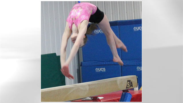 PHOTO: A young gymnast works the balance beam at Excel Gymnastics in Saugerties, New York.