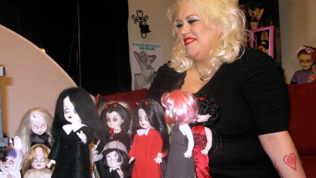 PHOTO: Marilyn Mansfield, a doll collector, sits in front of her dolls.