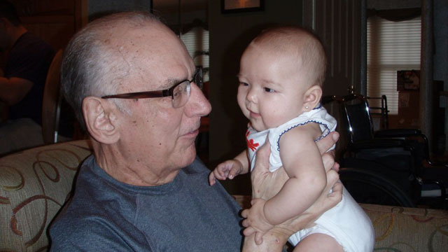 PHOTO: Grant Feusner holds his granddaughter, Jade.