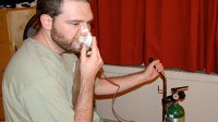 PHOTO Justin Ott, 31, uses oxygen therapy to stop the debilitating pain of his cluster headaches.