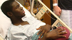PHOTO: In this photo Coach Tom Walter of Wake Forest, visits with his player Kevin Jordan one day after donating a kidney to him.