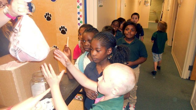 PHOTO: Kids waiting in line for bags of hope
