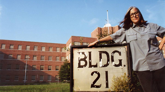 PHOTO: Filmmaker Lucy Winer poses outside Kings Park State Hospital in Long Island where she was a patient in the 1960s.