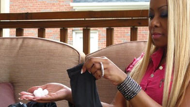 PHOTO: Alicia, who is addicted to smelling mothballs, putting them in her purse