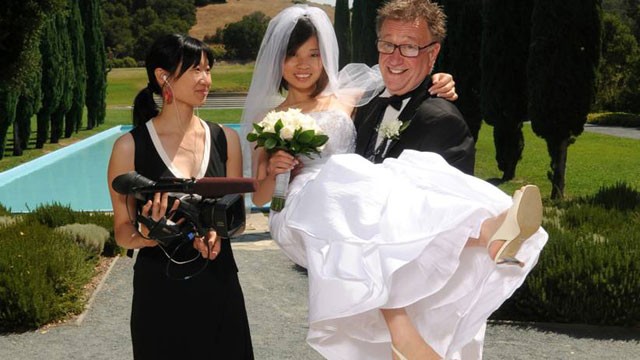 PHOTO: Steven and Sandy on their wedding day with Debbie Lum, director of the PBS film, "Seeking Asian Female."
