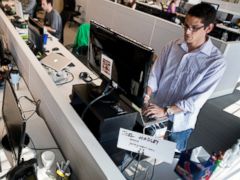 PHOTO: Joel Hadley, right, uses a standing desk at the Groupon offices in Chicago, July 30, 2012.