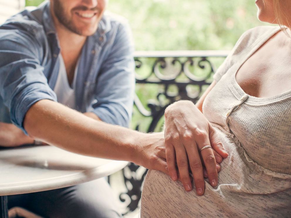 PHOTO: A pregnant woman and man touch her belly in this stock image.