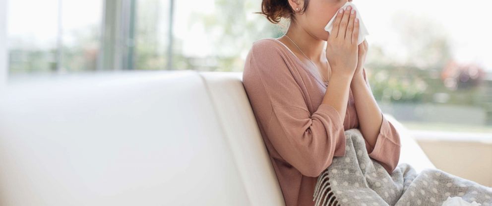 PHOTO: A sick woman blows her nose in this undated stock photo.