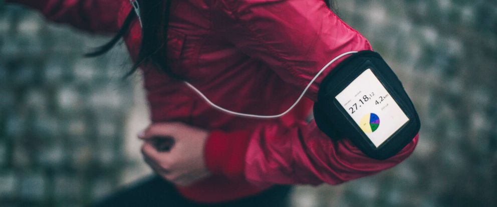 PHOTO: Woman exercising with a funning app on her smartphone.