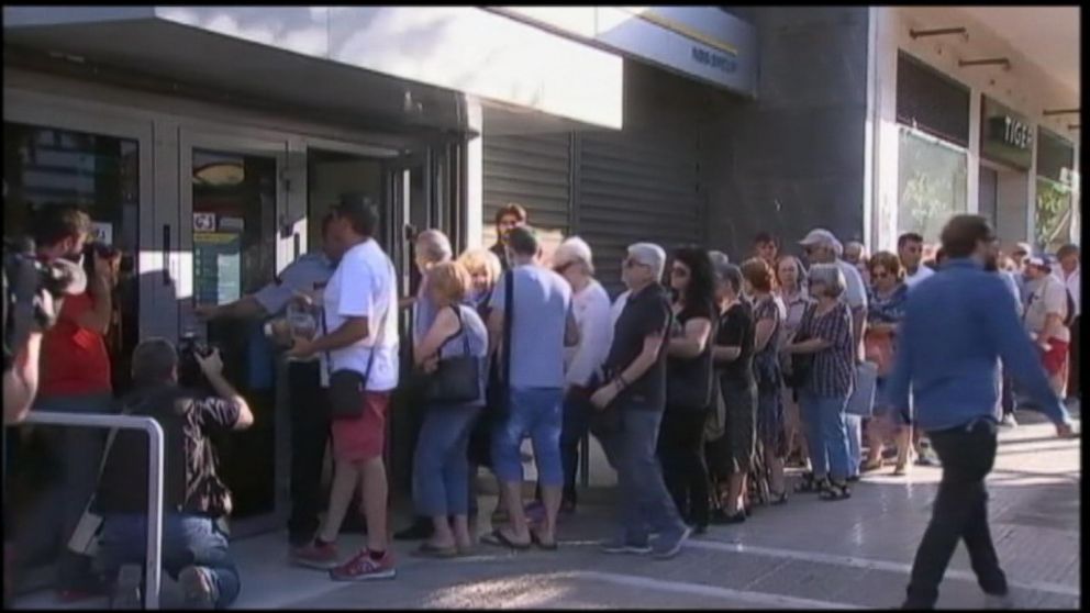 VIDEO: Restrictions on cash withdrawals remain in place however, as Greece also begins implementing new taxes on goods and services as part of negotiations for a bailout deal.