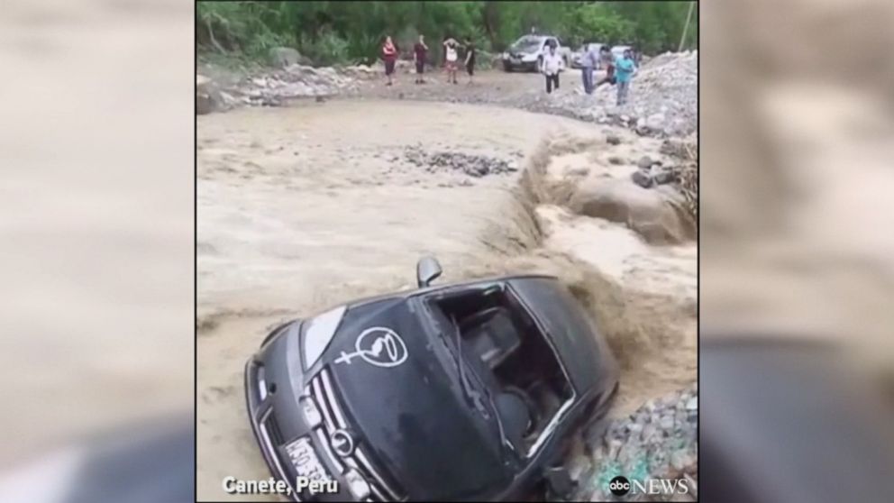 WATCH:  Man escapes from car being swept away in Peru floods