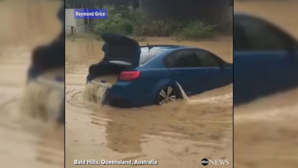 WATCH:  Floodwaters flow through submerged car in Australia