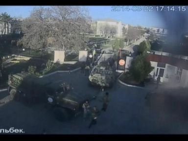 Russian Forces Storm Ukrainian Airbase in Crimea