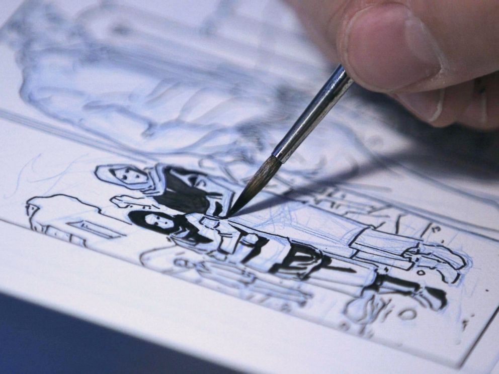 PHOTO: Dalibor Talajic drawing a panel from Madaya Mom.