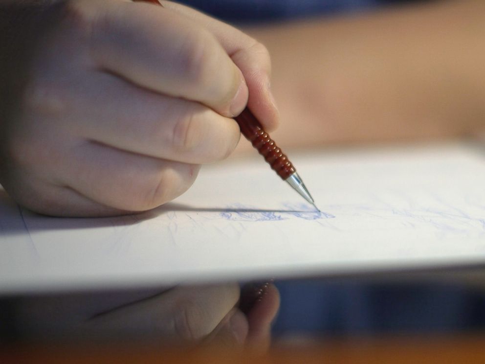 PHOTO: Dalibor Talajic drawing a panel from Madaya Mom.