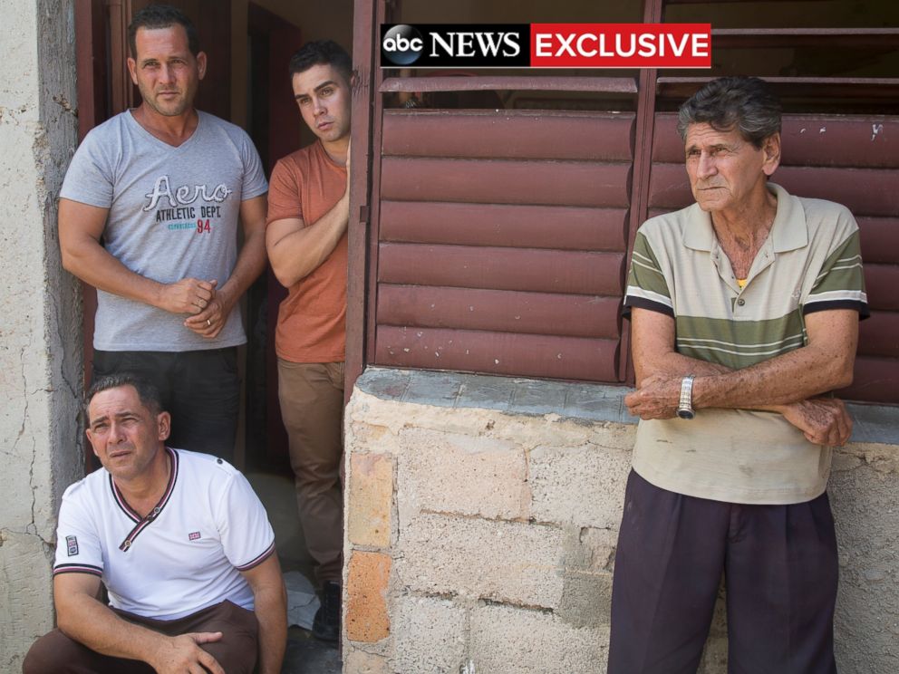 PHOTO: Elian Gonzalez with his father, grandfather and uncle at his birth home. 