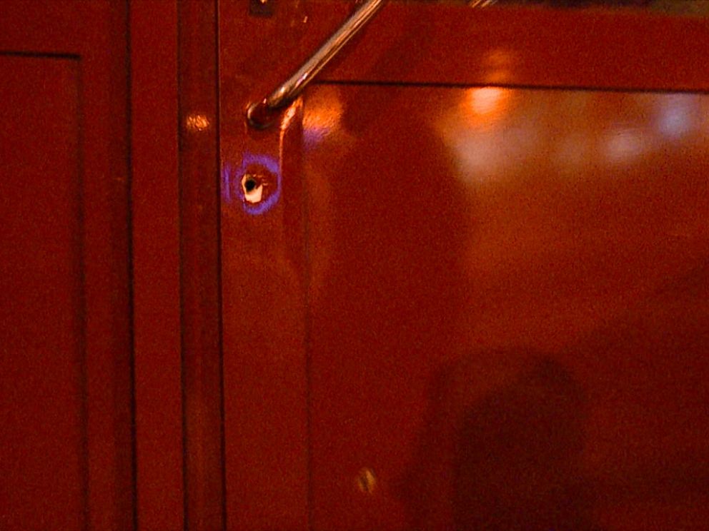 Bullet holes left in the front door of Central Station after an armed attack in November.