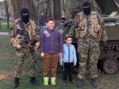 Ukrainian Children Smile and Pose With Pro-Russian Forces