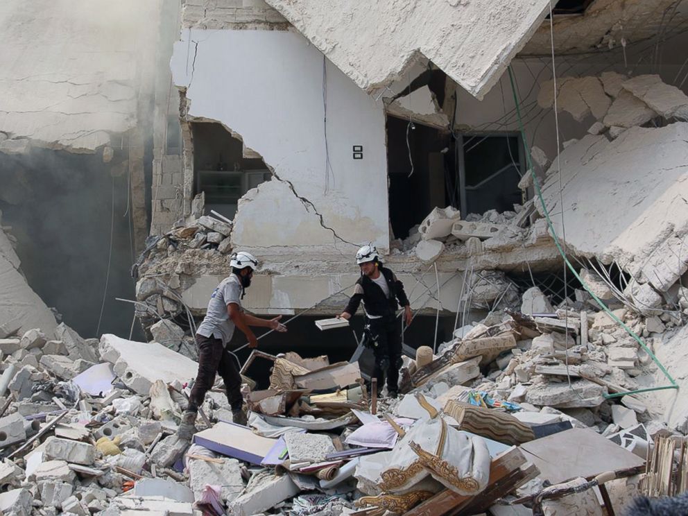 PHOTO: Syrian civil defense workers inspecting damaged buildings, after barrel bombs were dropped on the Bab al-Nairab neighborhood in Aleppo, Syria, Aug. 27, 2016. 