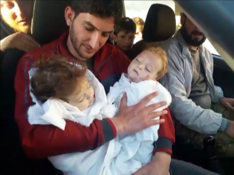 PHOTO:Abdel Hameed al-Youssef cradles the bodies of his nine month old twins after they were killed in a suspected chemical attack on Idlib in Syria on April 4, 2017. 