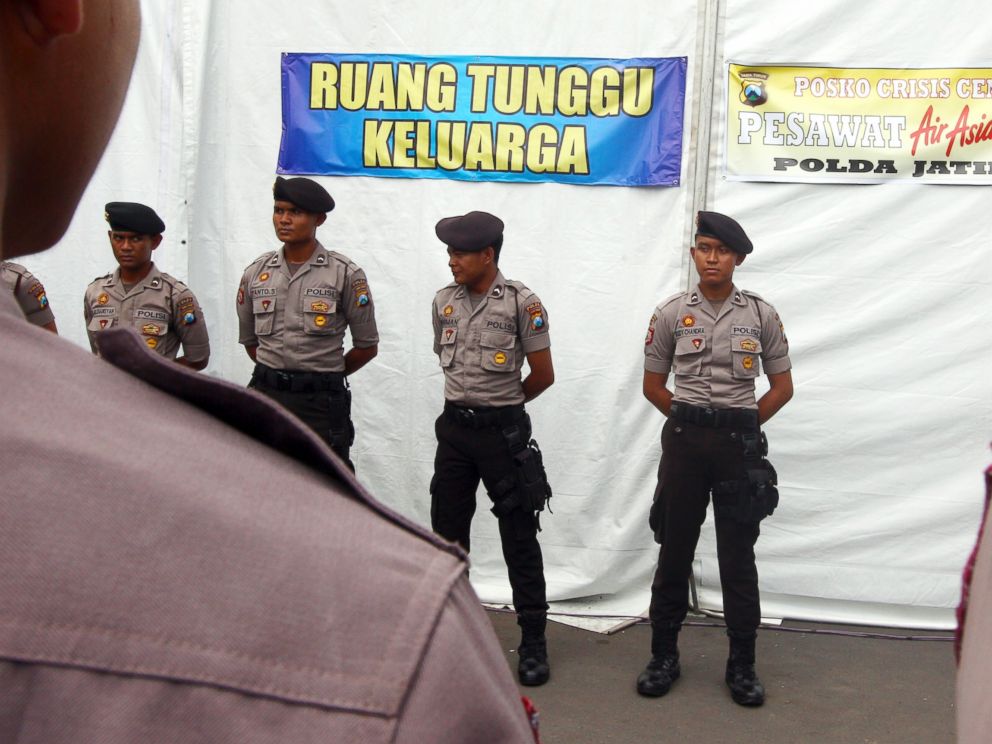 PHOTO: Indonesian police officers stand outside a family crisis center of AirAsia QZ 8501 in Surabaya, East Jave, Indonesia, Jan. 5, 2015.