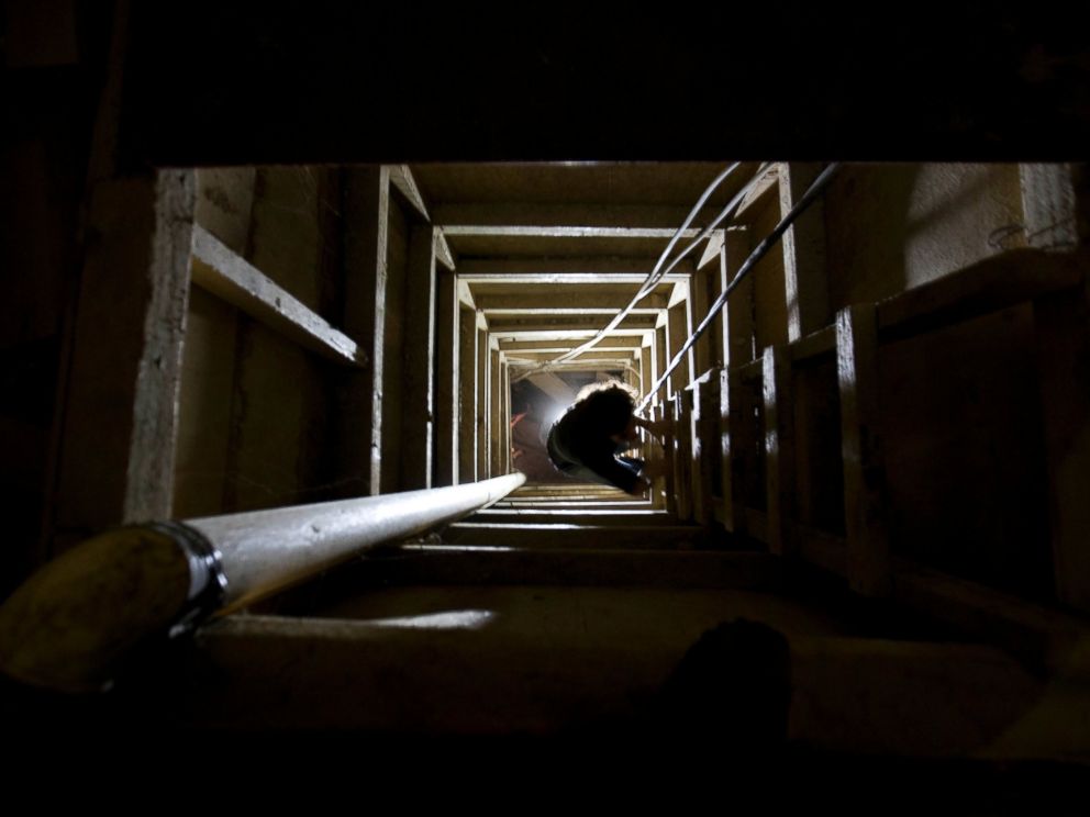PHOTO: A journalist climbs a ladder to get out of the tunnel that according to authorities, drug lord Joaquin El Chapo Guzman used to escape from the Altiplano maximum security prison in Almoloya, west of Mexico City, July 14, 2015.