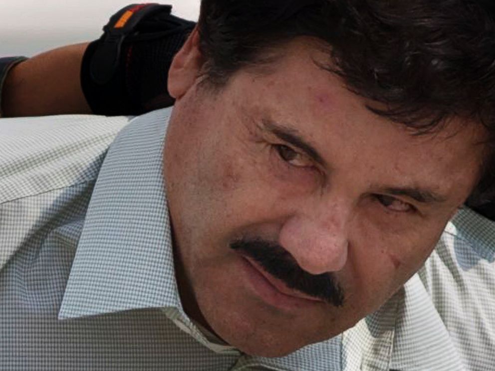 PHOTO: In this Feb. 22, 2014 photo, Joaquin El Chapo Guzman is escorted to a helicopter in handcuffs by Mexican navy marines at a navy hanger in Mexico City.