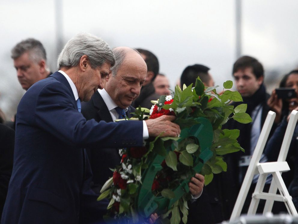 PHOTO: U.S. Secretary of State John Kerry, left, and French Foreign Minister Laurent Fabius lay flowers, Jan. 16, 2015, at the site of a kosher market where four hostages were killed in a terrorist attack last week in Paris, France.