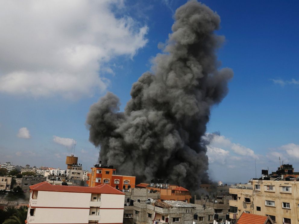 PHOTO: Smoke rises after an Israeli strike hit the offices of the Hamas movements Al-Aqsa satellite TV station, in Gaza City, northern Gaza Strip, July 31, 2014.