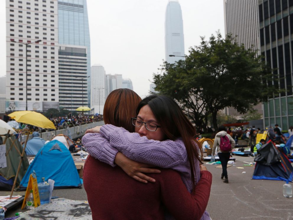 PHOTO: A protester cries as the police officers clear the barricades at the occupied area outside government headquarters in Hong Kong, Dec. 11, 2014.