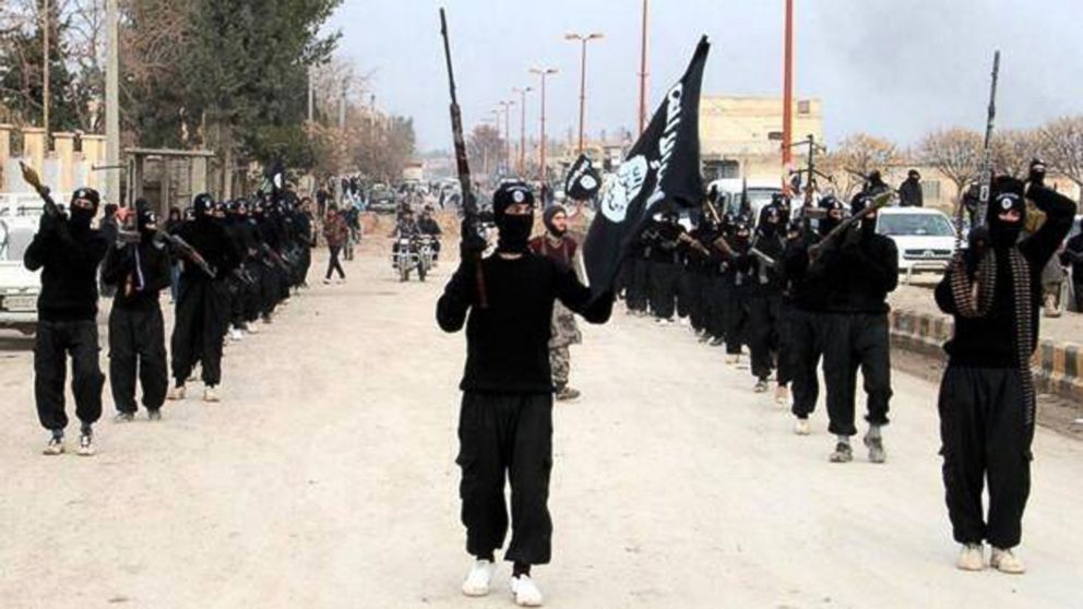 PHOTO: This undated file image posted on a militant website on Jan. 14, 2014, shows fighters from the al Qaida-linked Islamic State of Iraq and the Levant (ISIL) marching in Raqqa, Syria. 