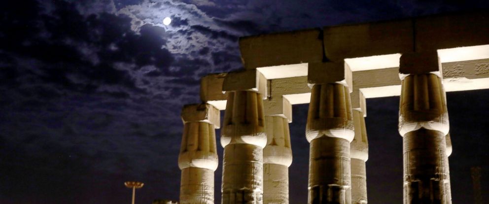 PHOTO: A full moon is seen over the ruins of Luxor Temple in Luxor, Egypt, Oct. 7, 2014.