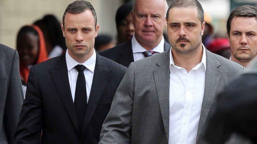 PHOTO: Oscar Pistorius walks to the high court in Pretoria, South Africa, April 9, 2014.