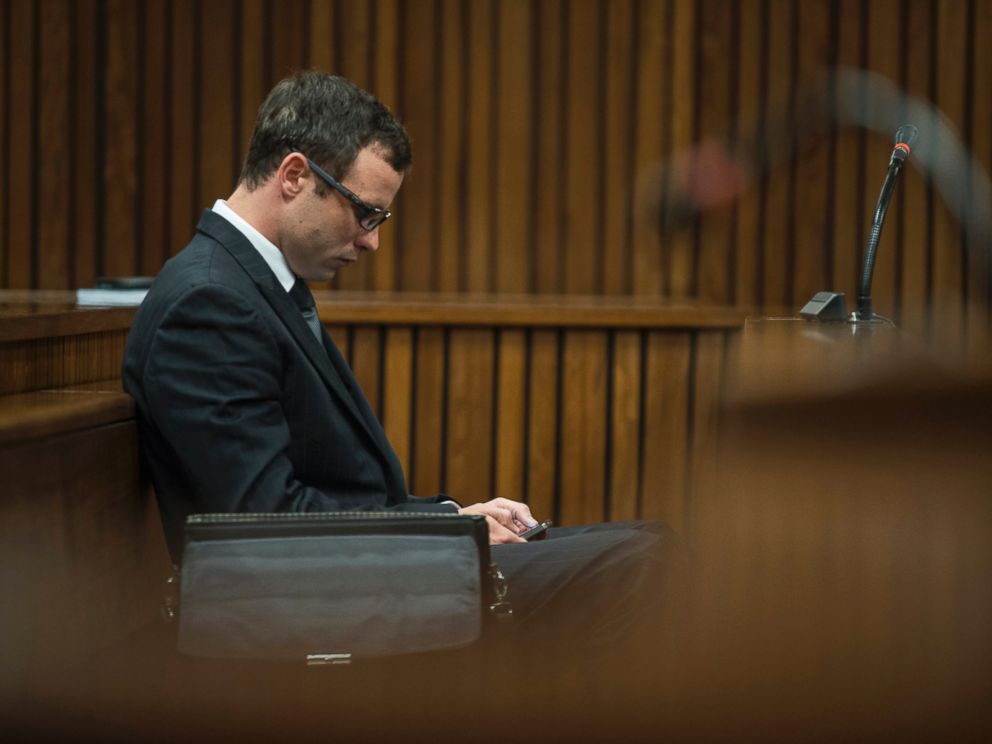 Oscar Pistorius appears in a courtroom at his murder trial in Pretoria, South Africa, Thursday, Aug. 7 2014.