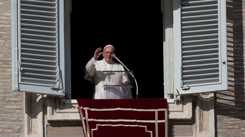 Pope Francis delivers his blessing during the Angelus noon prayer from his studios window overlooking St. Peters Square, at the Vatican, Nov. 16, 2014.