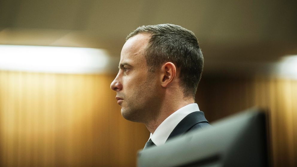PHOTO: Oscar Pistorius stands in the dock in court in Pretoria, South Africa, May 14, 2014, as the judge overseeing his murder trial ordered him to undergo psychiatric tests.