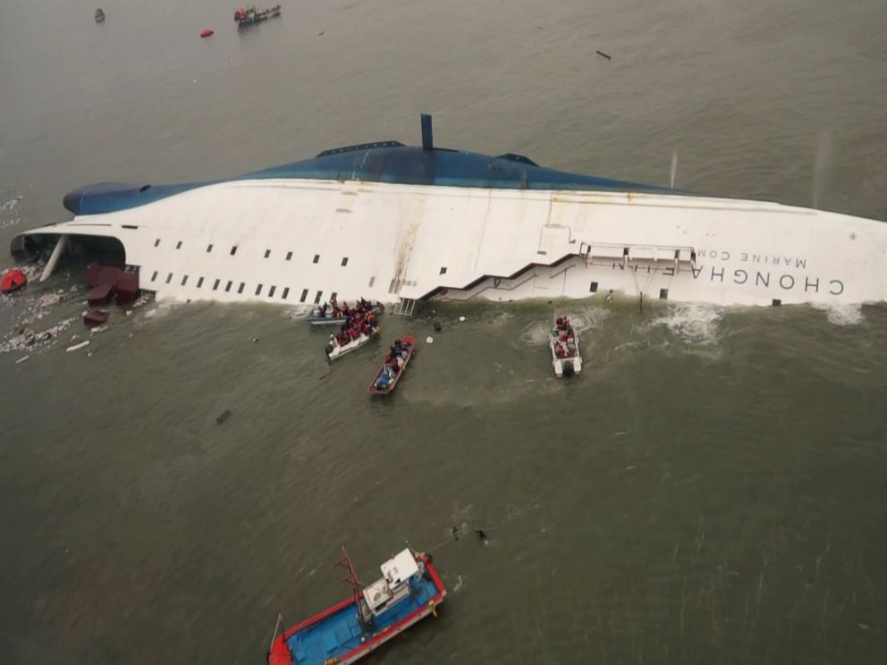 PHOTO: Boat crews try to rescue passengers from a ferry sinking off South Koreas southern coast, in the water off the southern coast near Jindo, south of Seoul, April 16, 2014.