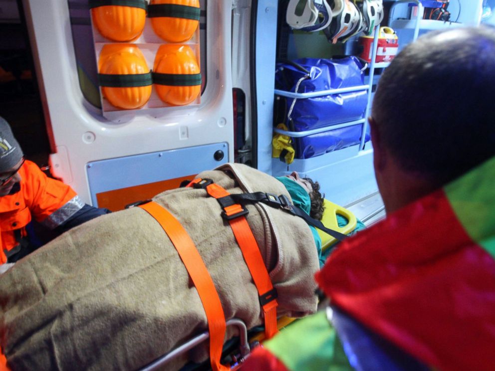 PHOTO: A woman is carried into an ambulance as rescued passengers of the ferry that caught fire in the channel between Italy and Albania are transported to the town of Otranto, near Lecce, southern Italy, Dec. 28, 2014. 