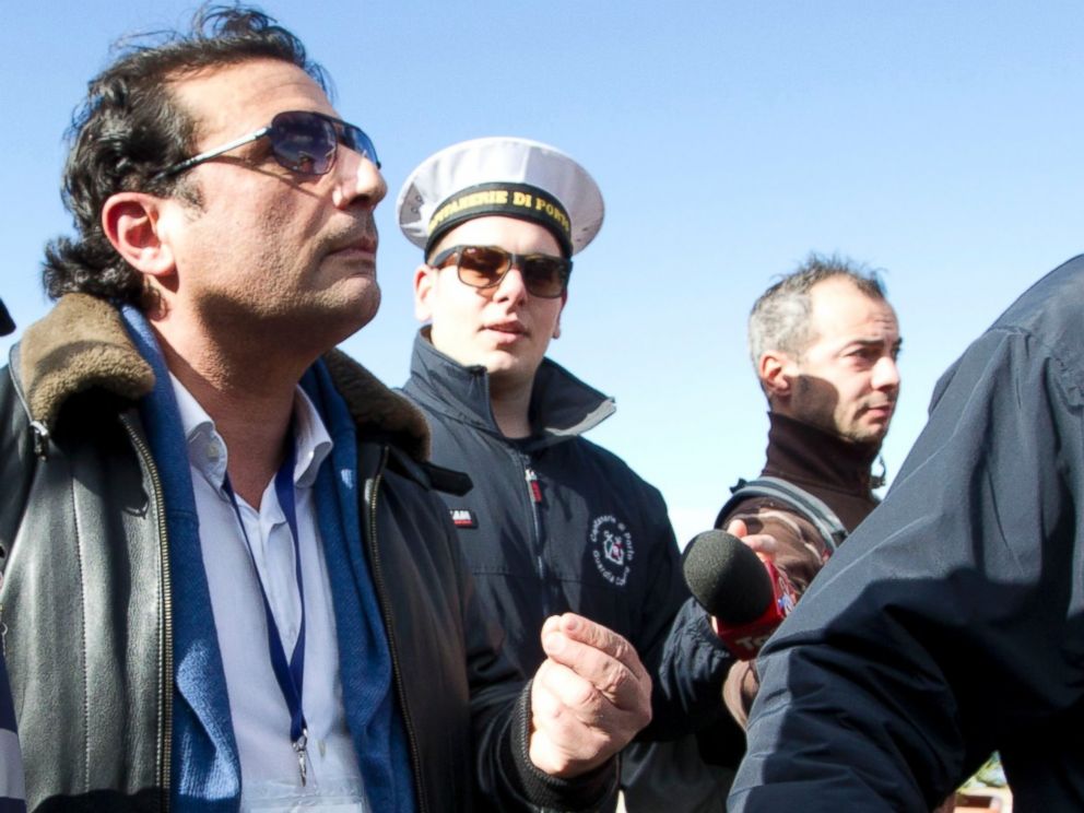 PHOTO: Captain Francesco Schettino walks in Giglio port after boarding the wreck of the Costa Concordia cruise ship, just off the coast of the Giglio island, Feb. 27, 2014.