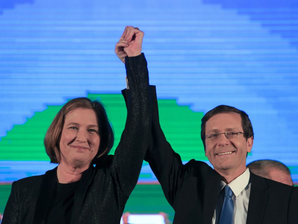 PHOTO: Zionist Union party co-leadesr Isaac Hezcog, right, and Tzipi Livni greet supporters at the partys election headquarters in Tel Aviv, March 18, 2015.