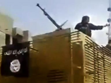 Black Flag of ISIS Militants Hangs Over Iraq Refinery
