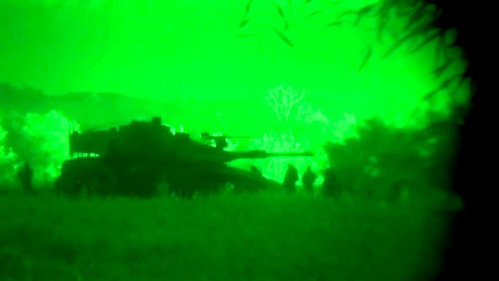 PHOTO: This image made from video shot through a night vision scope released by the Israeli military, July 18, 2014, shows a tank in the Gaza Strip during a ground offensive.