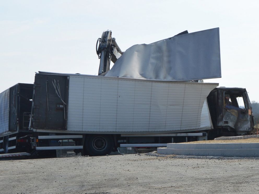 PHOTO: Burnt out vans are seen near the Avallon motorway exit, central France, on March 11, 2015.