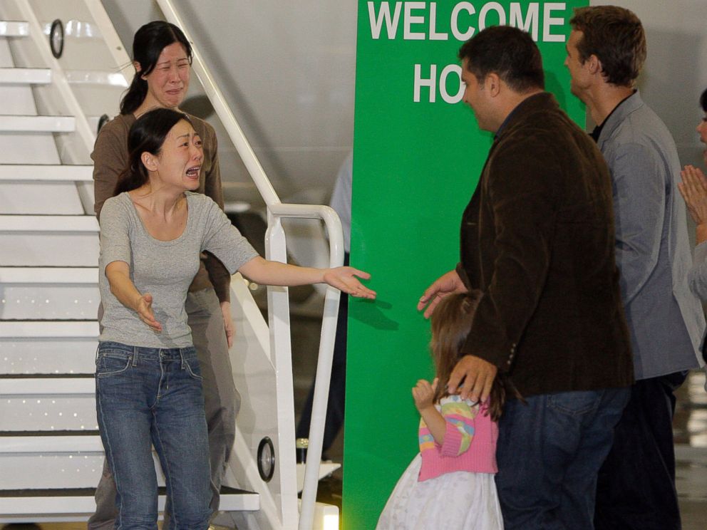 PHOTO: Euna Lee, left, and Laura Ling, two American journalists who were arrested in March after allegedly crossing into North Korea from China, are greeted after the two arrive at Bob Hope Airport in Burbank, Calif., Aug. 5, 2009.
